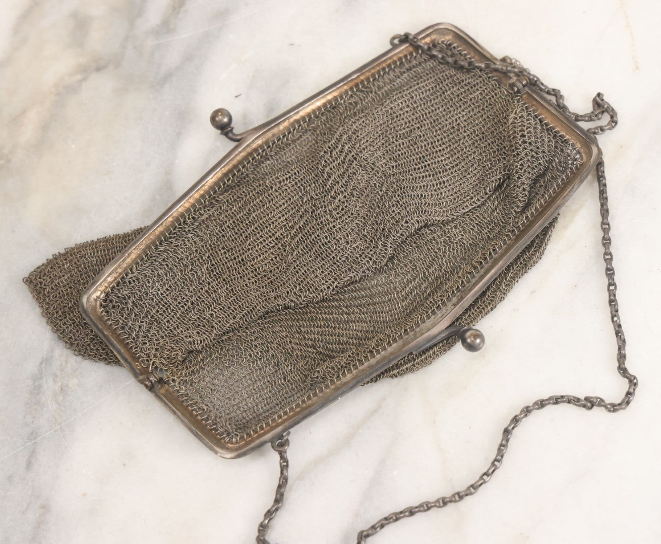 Lot 010 - Antique Whiting & Davis Co. German Silver Soldered Mesh Purse With Chain Handle And Engraved Lily Flower Decoration