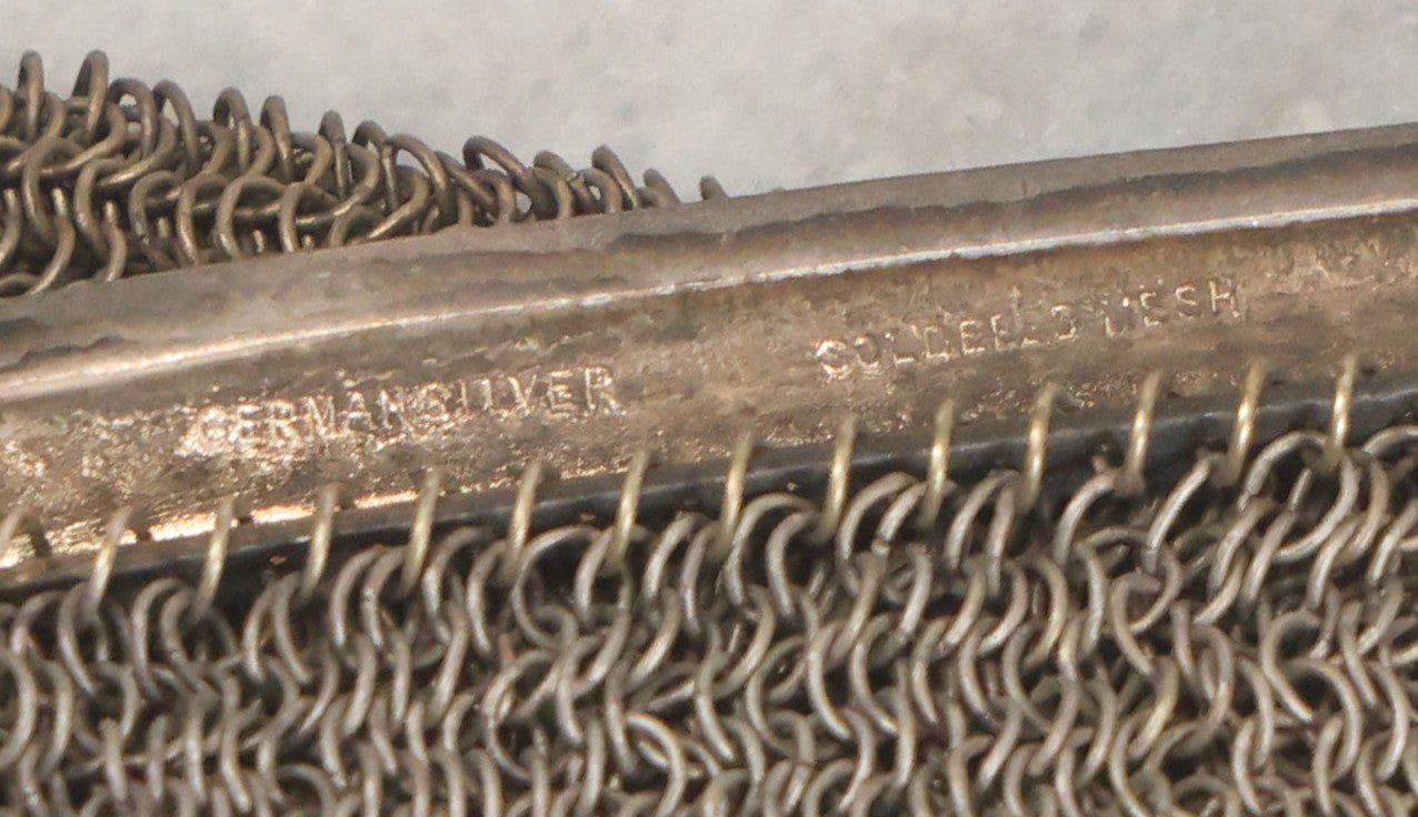 Lot 010 - Antique Whiting & Davis Co. German Silver Soldered Mesh Purse With Chain Handle And Engraved Lily Flower Decoration