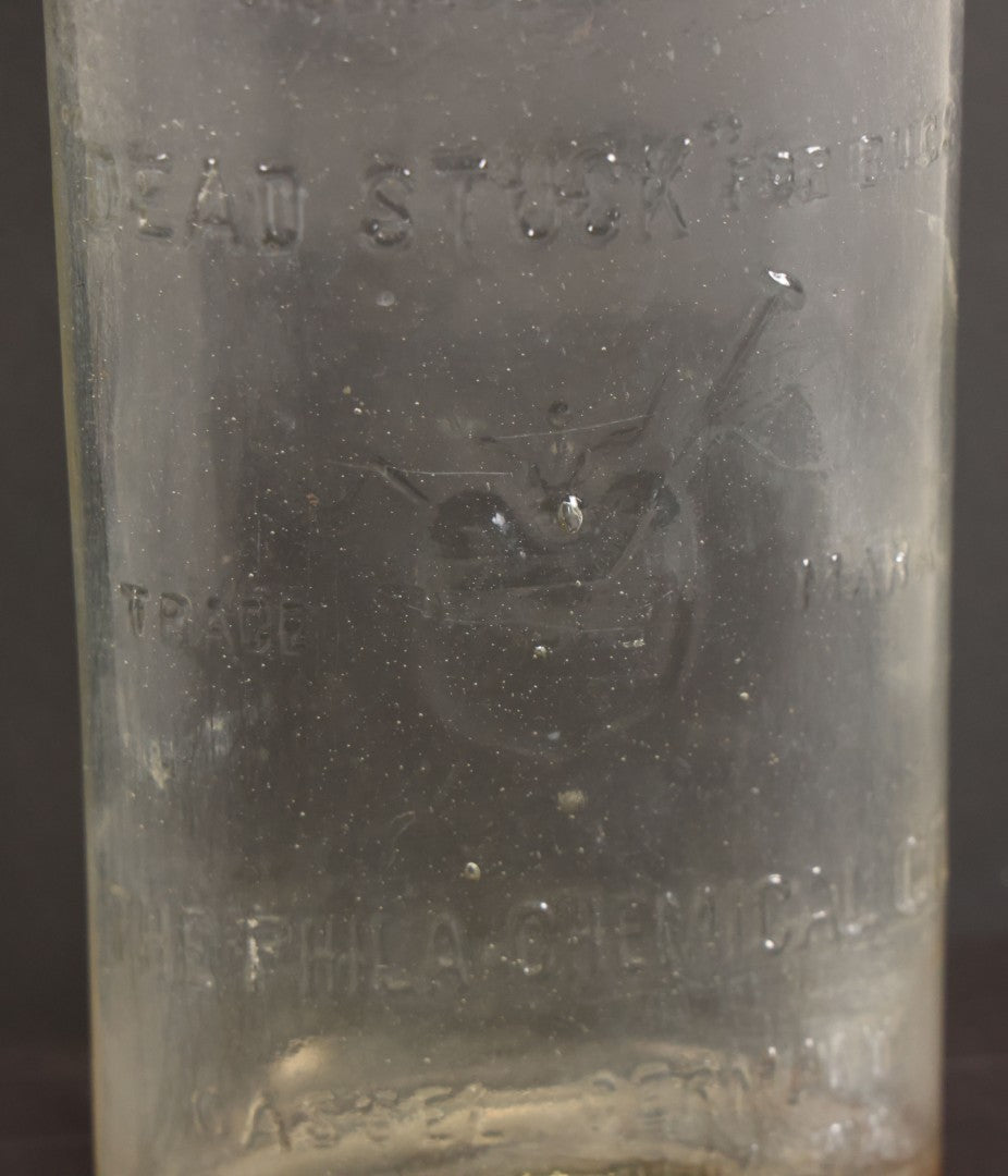 Lot 012 - Antique Bug Killer Glass Bottle, "Dead Stuck" For Bugs, With Pierced Bug Raised Graphic And Lettering, The Philadelphia Chemical Co., Castle, Germany, And Philadelphia, Pennsylvania, 8-5/8" Height