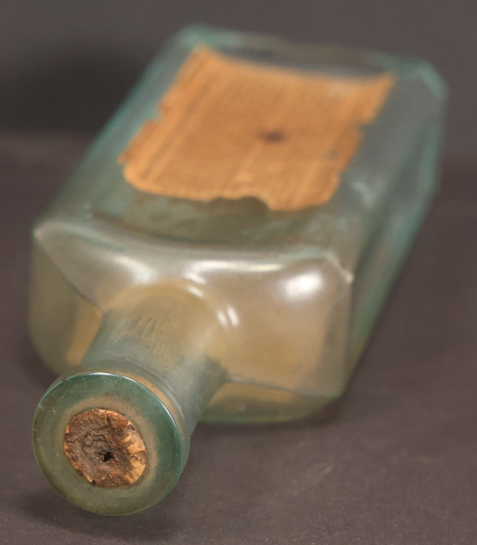 Lot 013 - Antique Bottle With Embossed Text And Original Paper Labels For Renne's Pain Killing Magic Oil Patent Medicine, "It Works Like A Charm; Clean Safe And Delicious" Manufactured By T.W. Warner & Co., New York, 6" Height