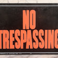 Lot 019 - Vintage Printed Tin Tacker Metal "No Trespassing" Black Sign, Manufactured By H.Y.-K.O. Products Co., Cleveland, Ohio, 14" W x 10" H