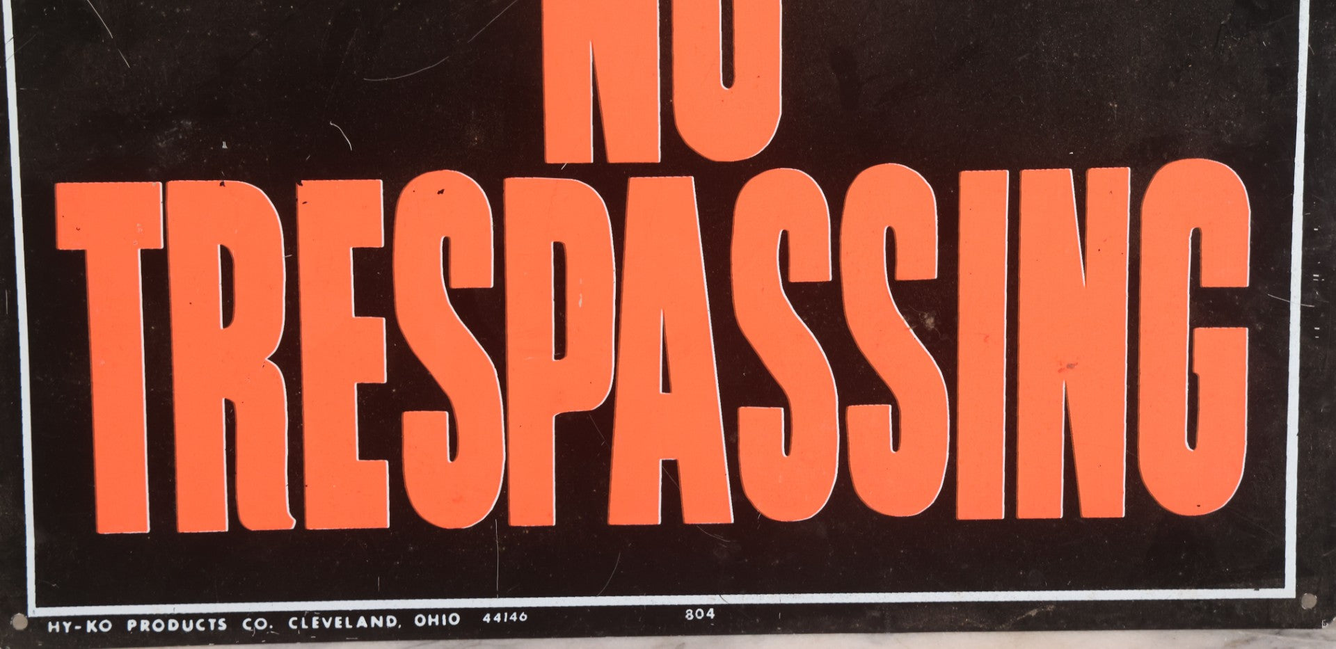 Lot 019 - Vintage Printed Tin Tacker Metal "No Trespassing" Black Sign, Manufactured By H.Y.-K.O. Products Co., Cleveland, Ohio, 14" W x 10" H