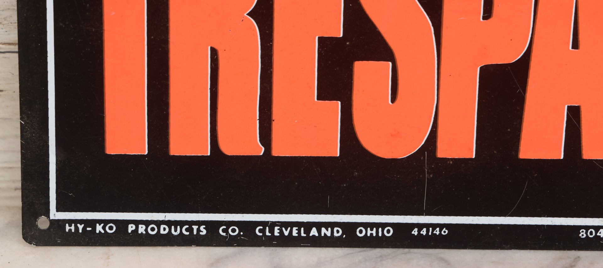 Lot 019 - Vintage Printed Tin Tacker Metal "No Trespassing" Black Sign, Manufactured By H.Y.-K.O. Products Co., Cleveland, Ohio, 14" W x 10" H