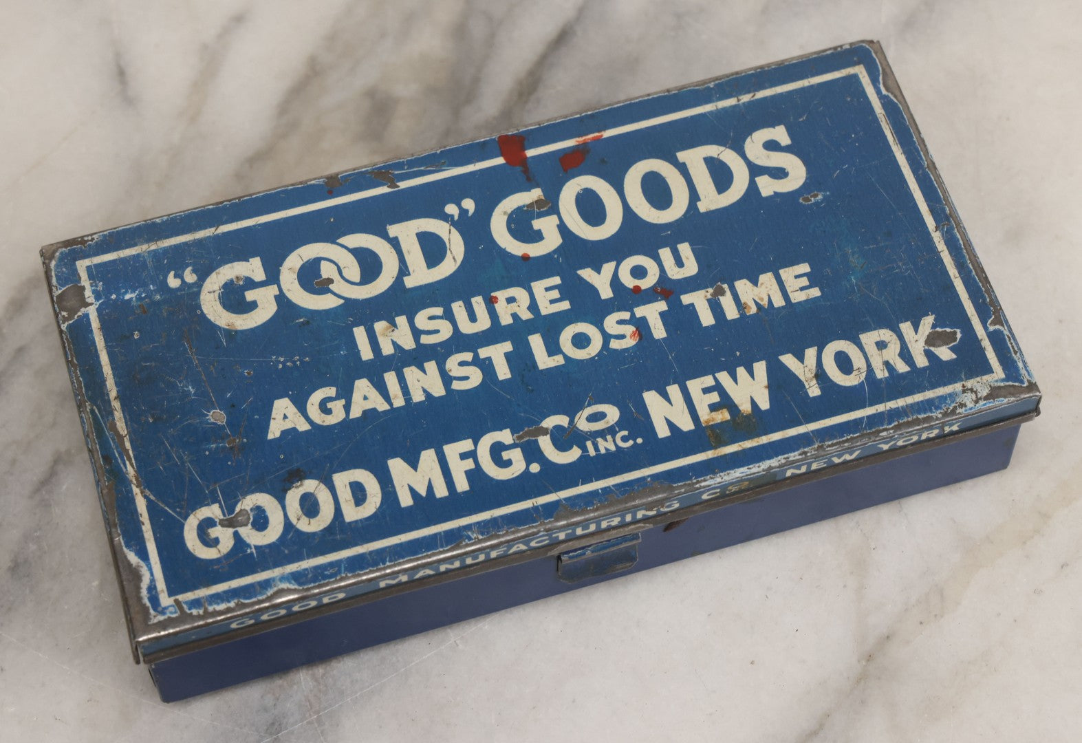 Lot 020 - Vintage "Good" Goods Divided Advertising Tin, "Insure You Against Lost Time," Good Manufacturing Co. Inc., New York