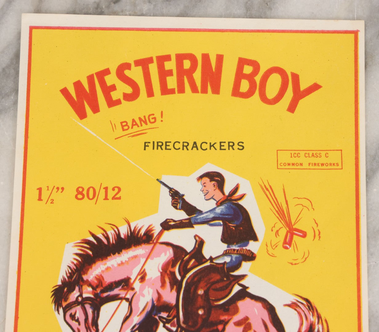 Lot 026 - Vintage Western Boy Firecrackers Lithographed Fireworks Label With Cowboy Graphics, Copyrighted And Distributed By Rich Brothers, Sioux Falls, South Dakota, Made In Macao