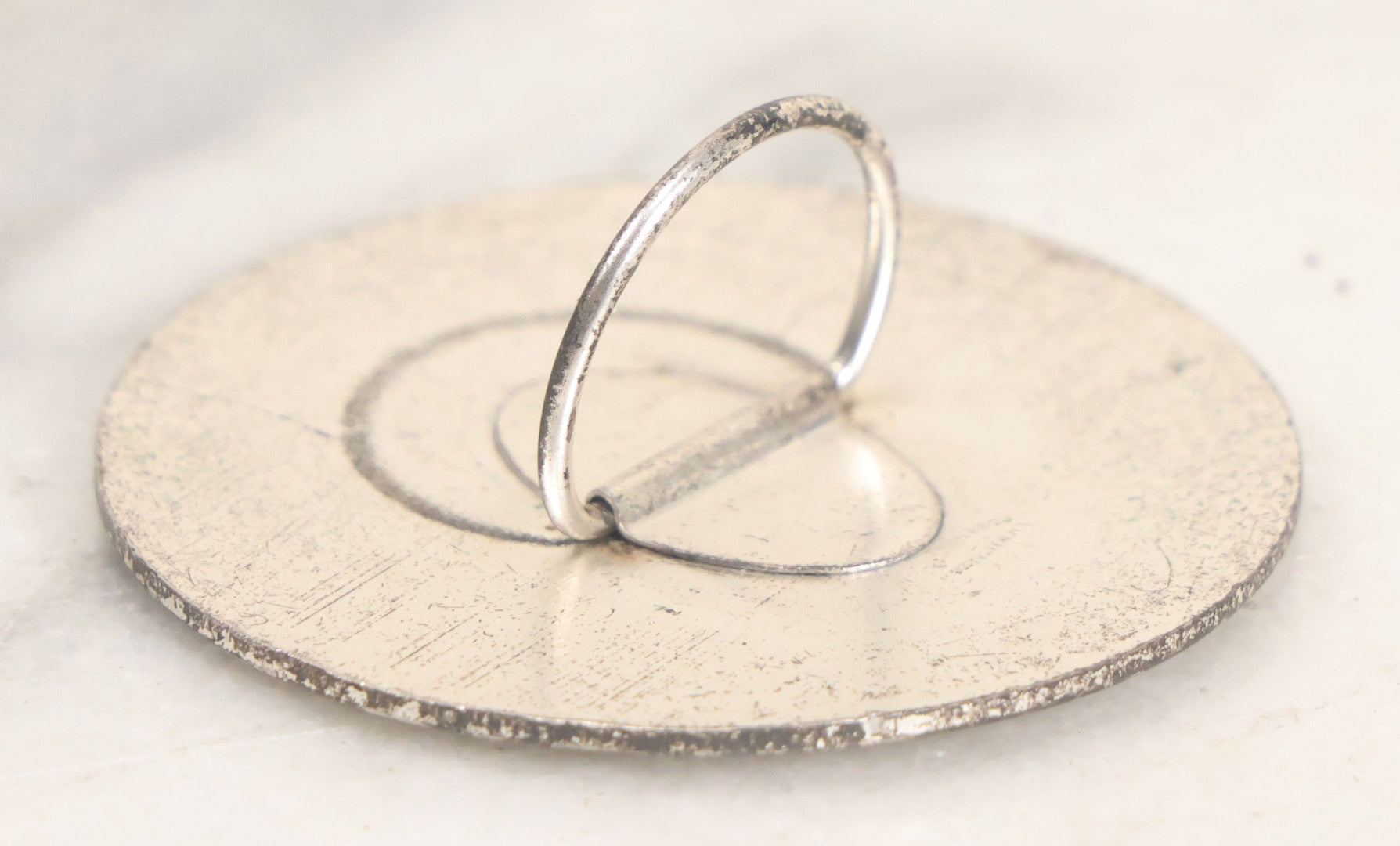 Lot 035 - Vintage Magician's Hypnotist Medallion With Eye At Center, Manufactured By Bastian Bros., Rochester, New York, 2-1/4" Diameter