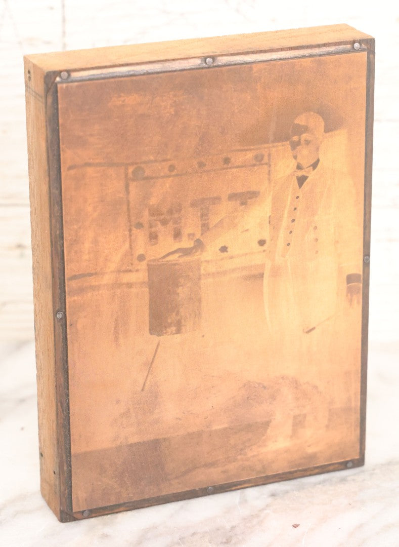 Lot 036 - Grouping Of Ten Vintage Photo Printing Blocks Showing A Magician Engaged In Various Magic Tricks, Magician's Banner Visible, "M.T.T.," Various Tricks Incl. Ring Trick, Flag Trick, And More