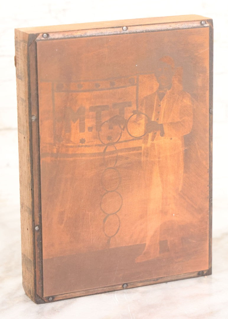 Lot 036 - Grouping Of Ten Vintage Photo Printing Blocks Showing A Magician Engaged In Various Magic Tricks, Magician's Banner Visible, "M.T.T.," Various Tricks Incl. Ring Trick, Flag Trick, And More