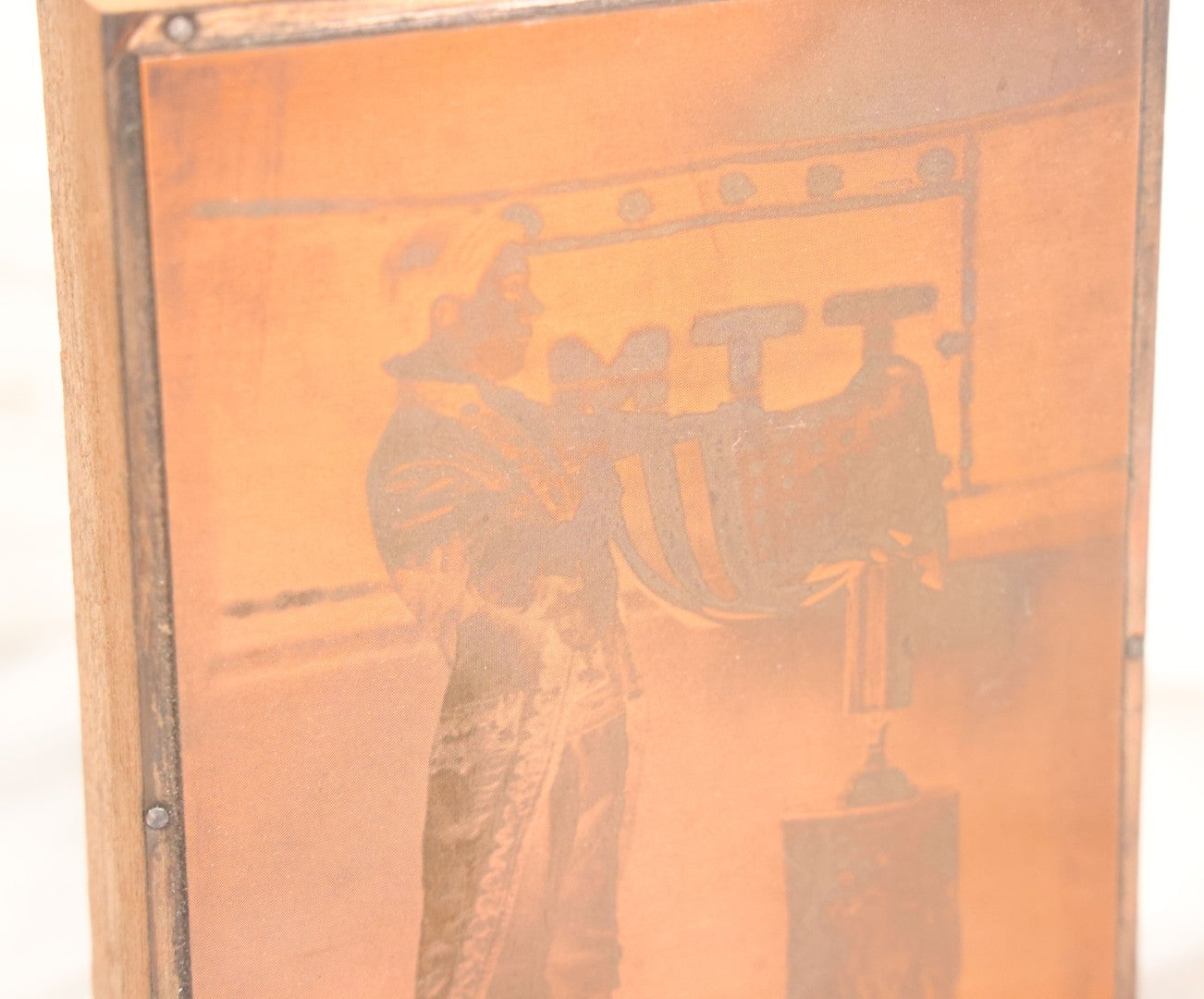 Lot 036 - Grouping Of Ten Vintage Photo Printing Blocks Showing A Magician Engaged In Various Magic Tricks, Magician's Banner Visible, "M.T.T.," Various Tricks Incl. Ring Trick, Flag Trick, And More