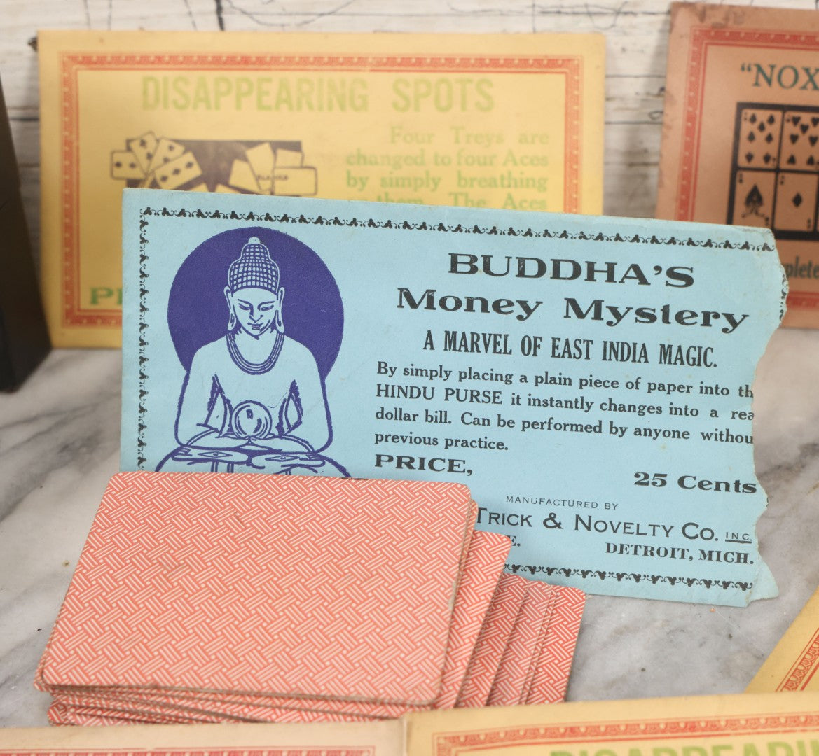 Lot 037 - Vintage Magician's Grouping With Several Foldered Card Tricks, Nesting Dice Tricks, String Of Cards Trick, Dummy Card Deck, And Other Misc. Pieces