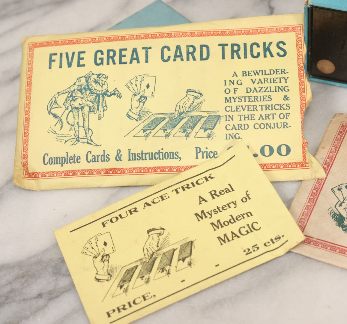 Lot 037 - Vintage Magician's Grouping With Several Foldered Card Tricks, Nesting Dice Tricks, String Of Cards Trick, Dummy Card Deck, And Other Misc. Pieces
