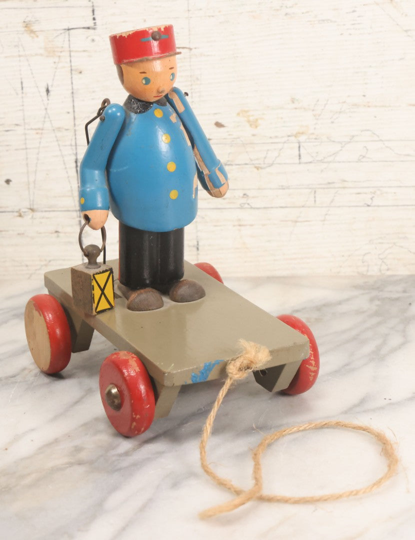 Lot 044 - Vintage Handmade Wooden Wheeled Cart With Train Conductor Holding Lantern Animated Pull Toy, Lantern Arm Moves Up And Down, Made In Czechoslovakia, Note Paint Losses