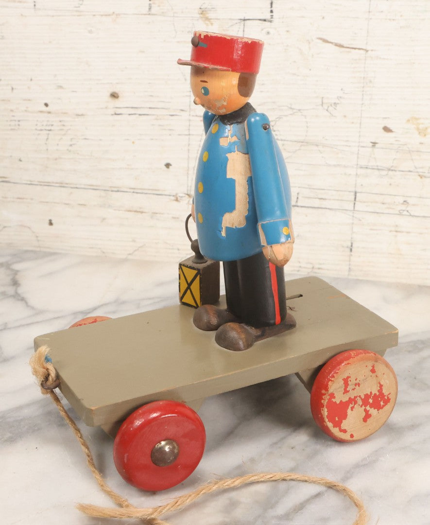 Lot 044 - Vintage Handmade Wooden Wheeled Cart With Train Conductor Holding Lantern Animated Pull Toy, Lantern Arm Moves Up And Down, Made In Czechoslovakia, Note Paint Losses