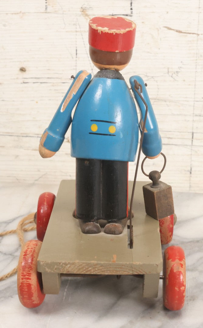 Lot 044 - Vintage Handmade Wooden Wheeled Cart With Train Conductor Holding Lantern Animated Pull Toy, Lantern Arm Moves Up And Down, Made In Czechoslovakia, Note Paint Losses