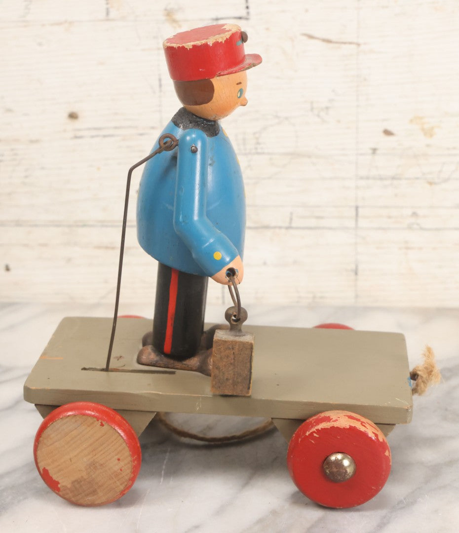 Lot 044 - Vintage Handmade Wooden Wheeled Cart With Train Conductor Holding Lantern Animated Pull Toy, Lantern Arm Moves Up And Down, Made In Czechoslovakia, Note Paint Losses