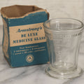 Lot 049 - Vintage Armstrong's De Luxe Medicine Glass One Ounce Dosage Measuring Cup In Box, Drug Sundries Department, Armstrong Cork Co., Lancaster, Pennsylvania
