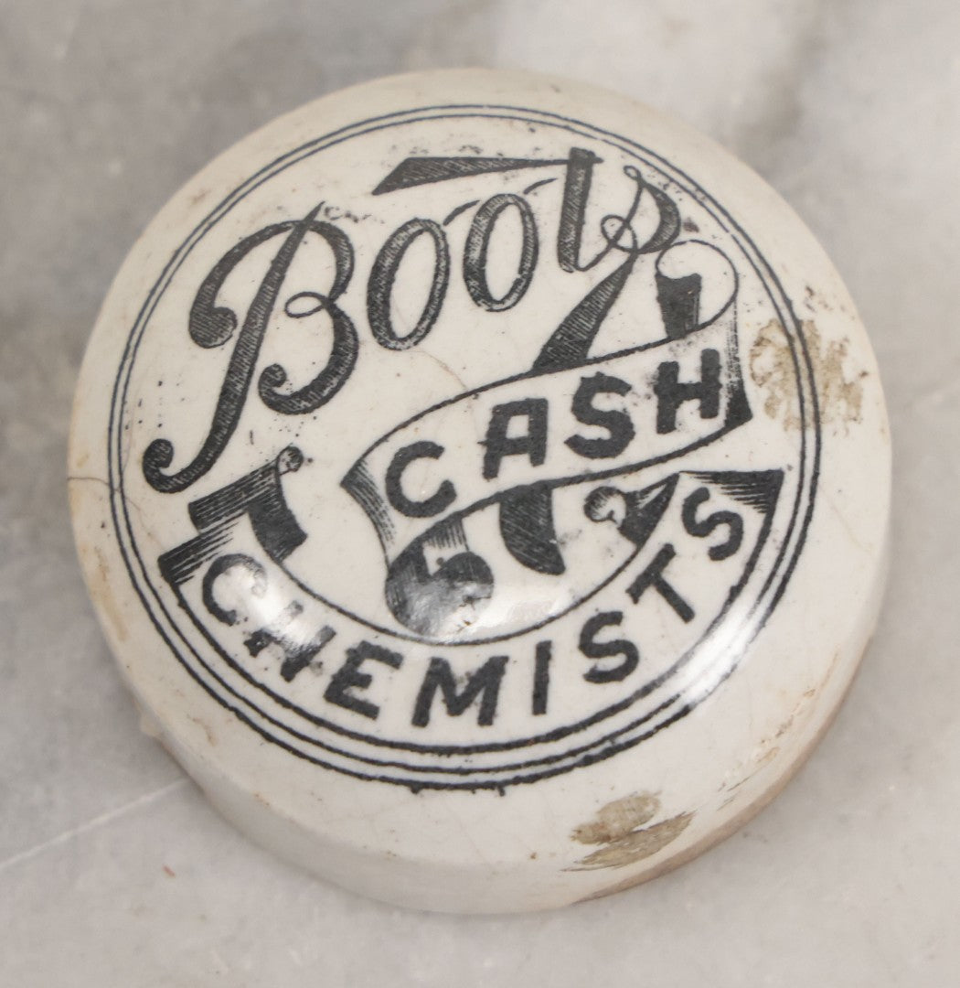 Lot 050 - Antique "Boots Cash Chemists" Decorated Stoneware Apothecary Lid