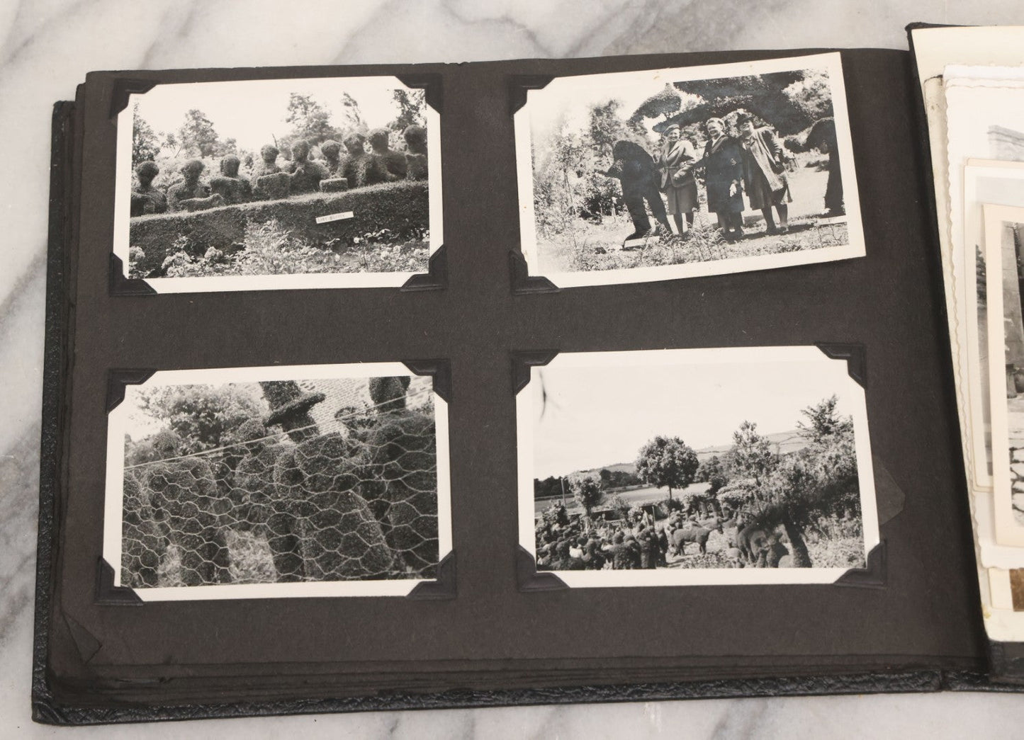 Lot 072 - Vintage Snapshot Photo Album With 80+ Photographs, Including Photos Of Europe, Naval Submarines And Battleships, Figural Topiary Sculpture Shrub Garden, Old Stone Houses, Pets And More, Many Loose Photos