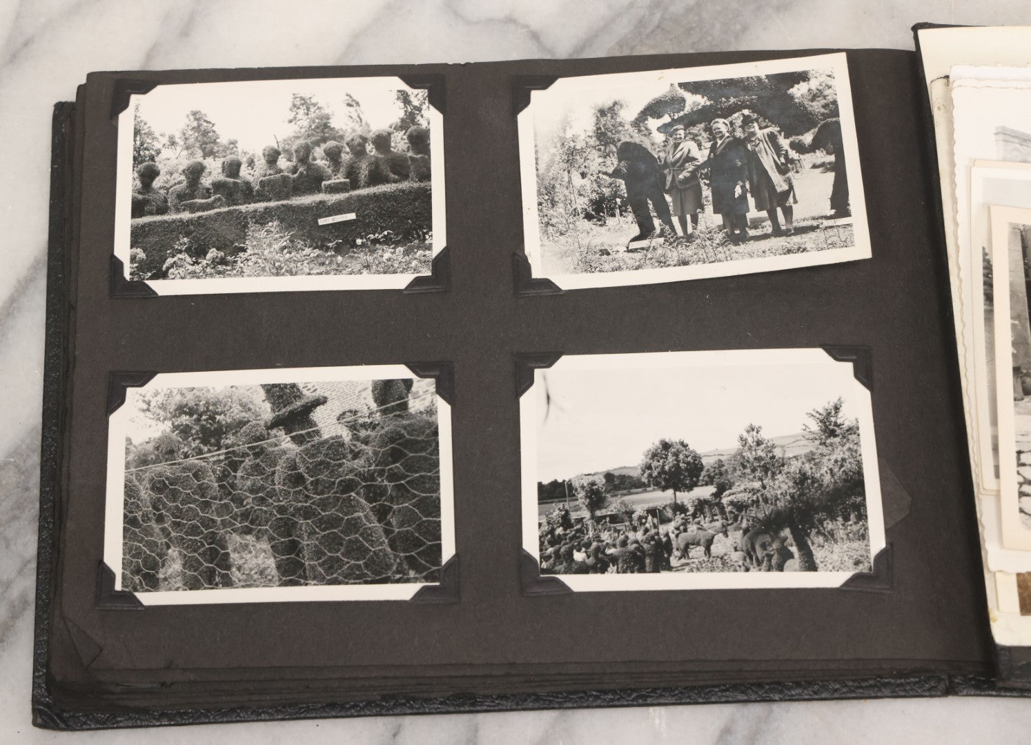 Lot 072 - Vintage Snapshot Photo Album With 80+ Photographs, Including Photos Of Europe, Naval Submarines And Battleships, Figural Topiary Sculpture Shrub Garden, Old Stone Houses, Pets And More, Many Loose Photos