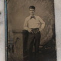 Lot 073 - Single Antique Tintype Photograph Of Well-Dressed Fella Wearing White Shirt, Polka Dot Bowtie, Cap, And Watch Chain, With A Cool Pose