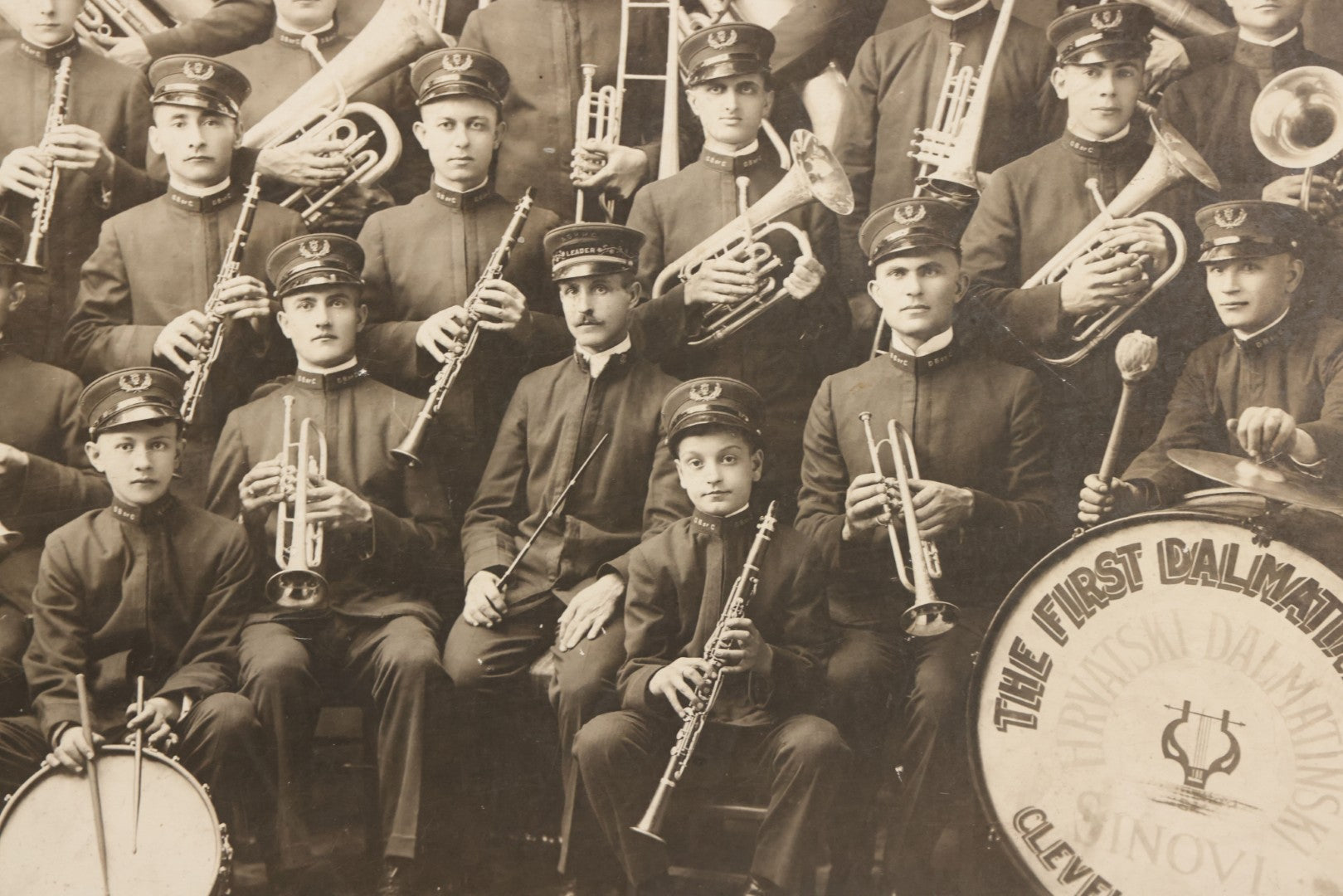Lot 077 - Antique Boarded Photograph Of The First Dalmation Band, Hrvatski Dalmatianski Sinovi (Croatian Dalmatian Sons), Twenty-One Piece Horn And Drum Band