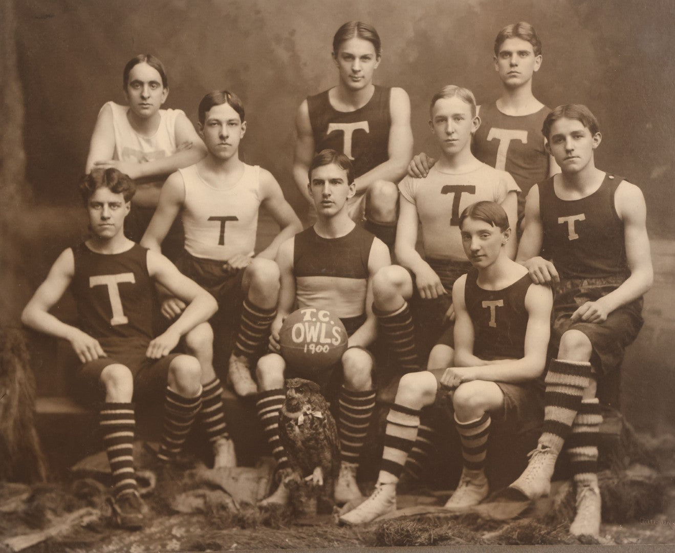 Lot 078 - Antique Boarded Photograph Of High School Basketball Team, The T.C. Owls, Posing With Owl Mascot, In Handmade Jerseys, 1900, F. Gutekunst, Photographer, Philadelphia, Pennsylvania