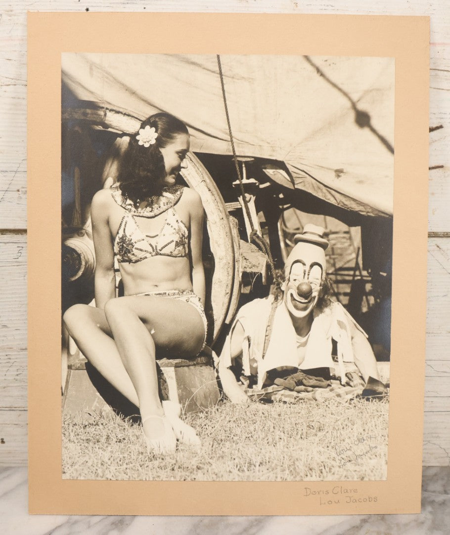Lot 079 - Vintage Boarded Photograph Of Costume Designer Doris Clare Posing With Circus Clown Lou Jacobs, Both In Costume, In Front Of Circus Wagon