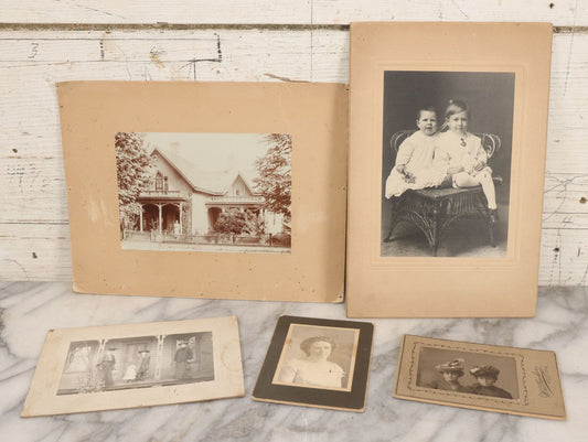 Lot 081 - Five Piece Antique Boarded Photography Grouping Including Woman Posing With Her Home, Two Children On Wicker Chair, Portraits Of Ladies, And Family Standing On Porch