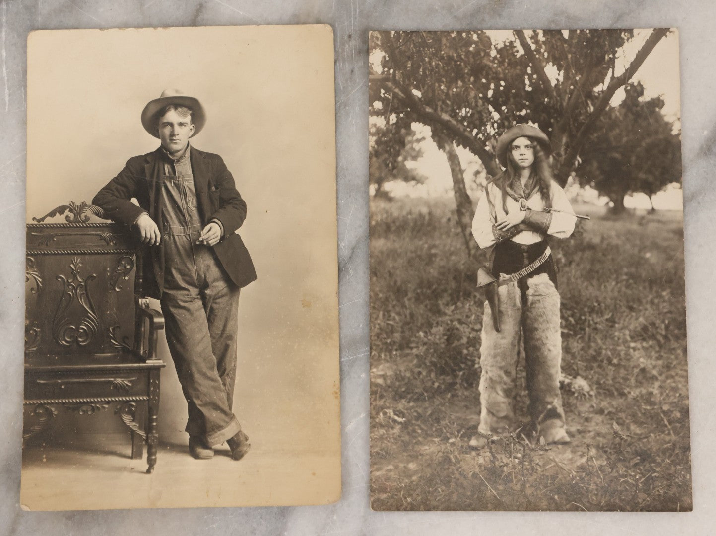 Lot 083 - Pair Of Antique Real Photo Postcards R.P.P.C. Of A Gun Slingin' Cowgirl Holding A Revolver, Dated August 1912 On Verso, And Kind Looking Farm Boy In Coveralls And Cowboy Hat Smoking
