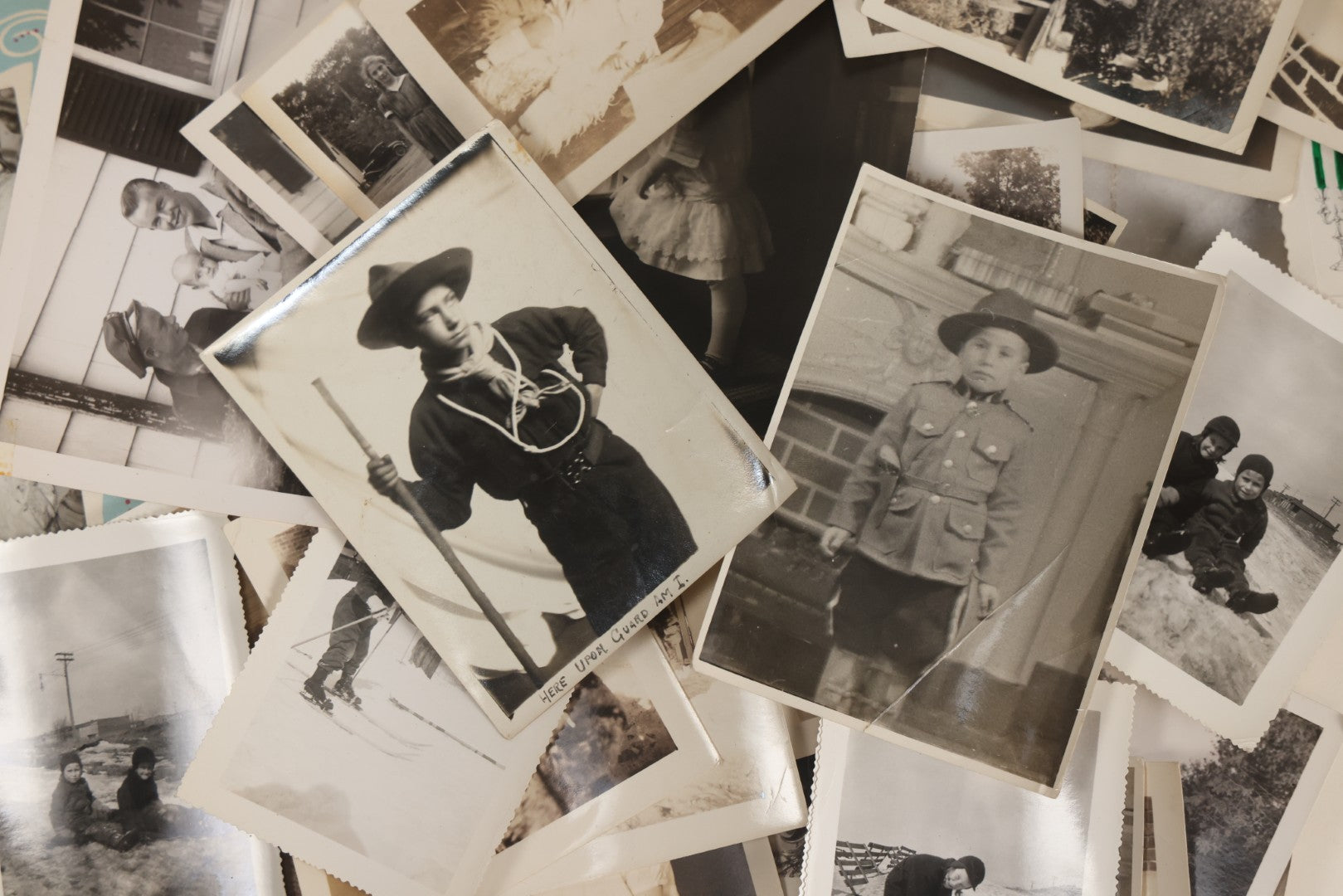 Lot 085 - Grouping Of 50+ Vintage Snapshot Photographs, Mostly Of Children At Play, Including Boy Dressed As Cowboy, Boy Dressed As Canadian Mountie Police Officer With Pistol, Children Skiing, Sledding, And More, Circa 1920s To 1960s