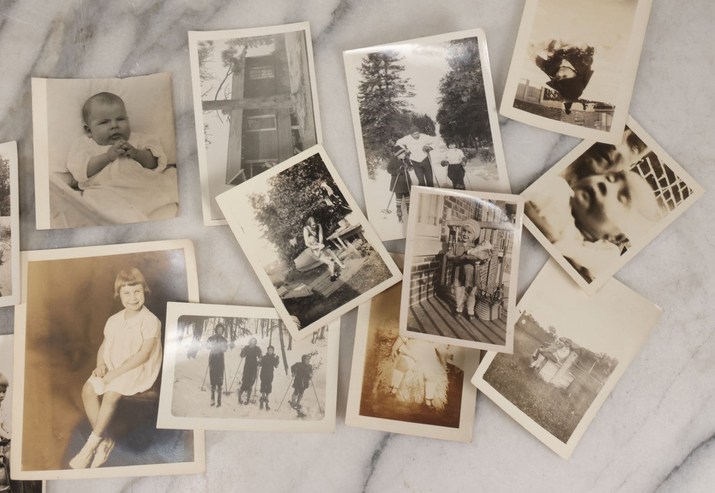 Lot 085 - Grouping Of 50+ Vintage Snapshot Photographs, Mostly Of Children At Play, Including Boy Dressed As Cowboy, Boy Dressed As Canadian Mountie Police Officer With Pistol, Children Skiing, Sledding, And More, Circa 1920s To 1960s
