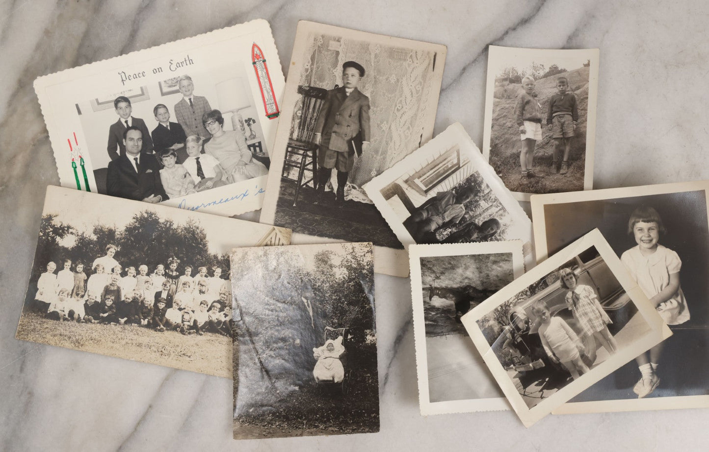 Lot 085 - Grouping Of 50+ Vintage Snapshot Photographs, Mostly Of Children At Play, Including Boy Dressed As Cowboy, Boy Dressed As Canadian Mountie Police Officer With Pistol, Children Skiing, Sledding, And More, Circa 1920s To 1960s