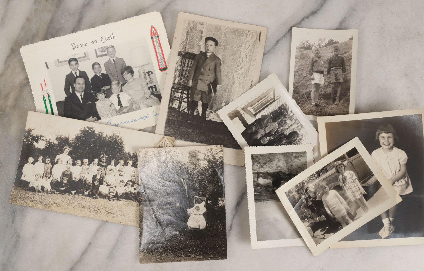 Lot 085 - Grouping Of 50+ Vintage Snapshot Photographs, Mostly Of Children At Play, Including Boy Dressed As Cowboy, Boy Dressed As Canadian Mountie Police Officer With Pistol, Children Skiing, Sledding, And More, Circa 1920s To 1960s