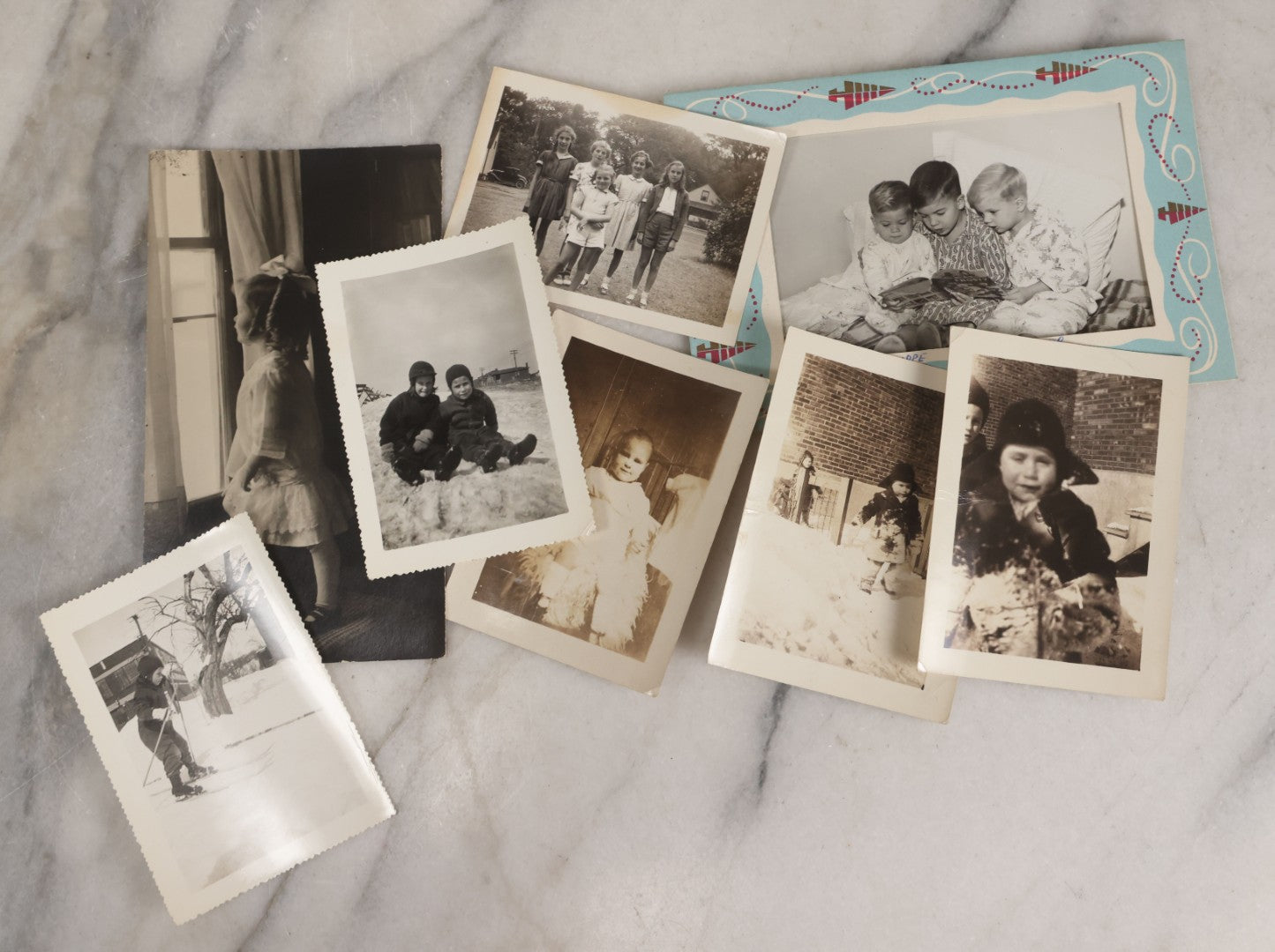 Lot 085 - Grouping Of 50+ Vintage Snapshot Photographs, Mostly Of Children At Play, Including Boy Dressed As Cowboy, Boy Dressed As Canadian Mountie Police Officer With Pistol, Children Skiing, Sledding, And More, Circa 1920s To 1960s