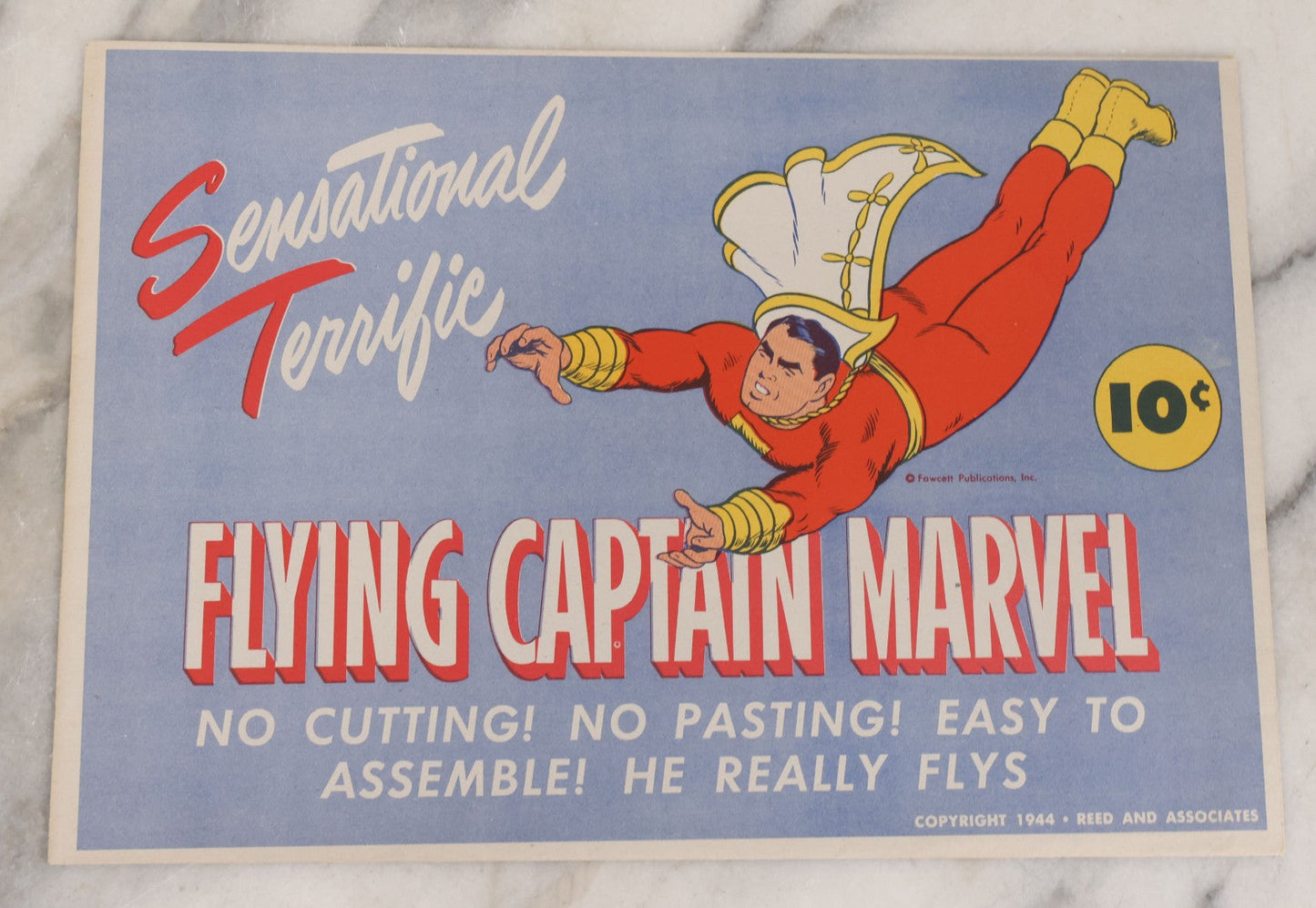 Lot 091 - Vintage Flying Captain Marvel "Sensational Terrific" Paper Craft Toy In Original Folder, Appears To Be Complete, Copyright 1944, Reed And Associates, Fawcett Publications Inc.