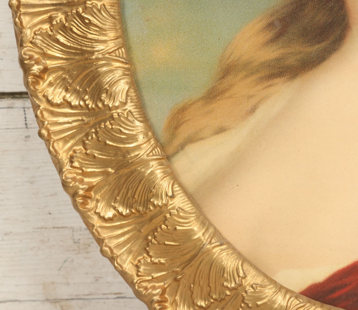 Lot 006 - Antique Chromolithograph Portrait Print Of Blue-Eyed Brunette Beauty With Red Velvet Cap And Loose Fitting Red Gown In Ornate Gilded Molded Gesso Oval Frame, 21" x 25"