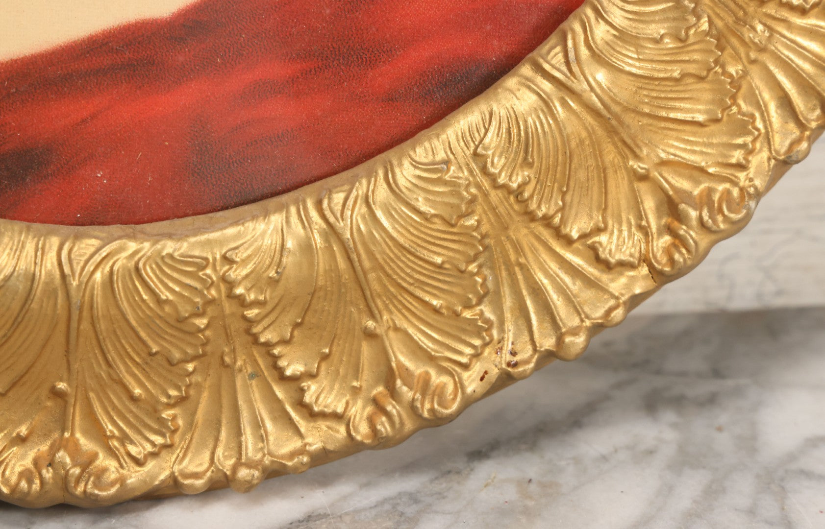 Lot 006 - Antique Chromolithograph Portrait Print Of Blue-Eyed Brunette Beauty With Red Velvet Cap And Loose Fitting Red Gown In Ornate Gilded Molded Gesso Oval Frame, 21" x 25"