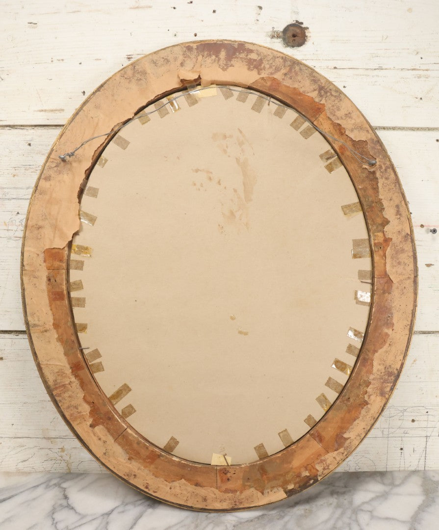 Lot 006 - Antique Chromolithograph Portrait Print Of Blue-Eyed Brunette Beauty With Red Velvet Cap And Loose Fitting Red Gown In Ornate Gilded Molded Gesso Oval Frame, 21" x 25"