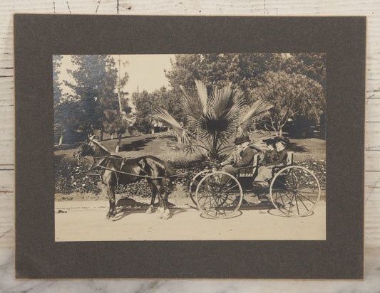 Lot 143 - Antique Boarded Photograph Of Two Men And Two Women Sitting In Horse Drawn Cart Pulled By A Black Horse In Westlake Park, Los Angeles, California