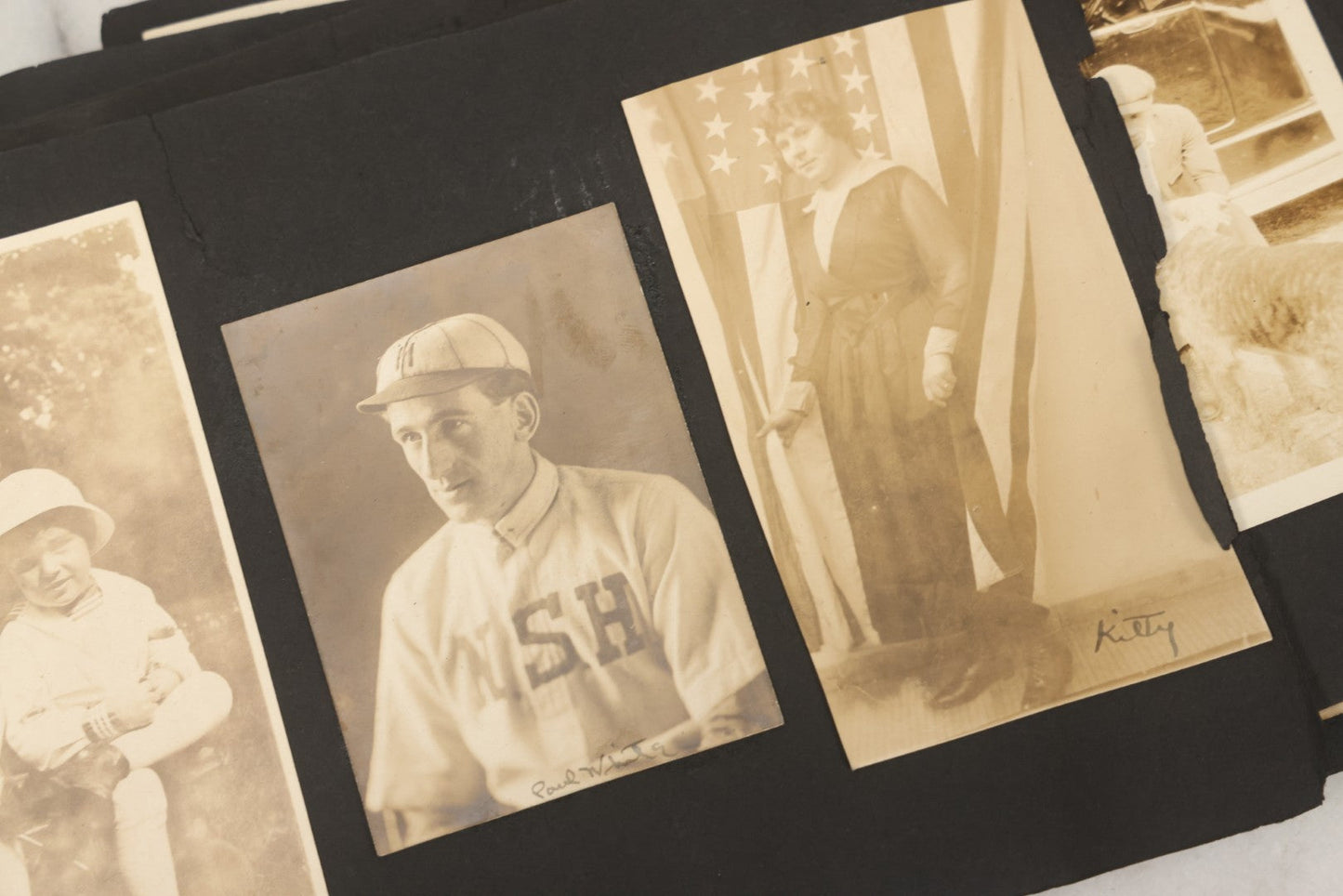 Lot 010 - Antique Vernacular Snapshot Photo Album With 90+ Photographs Circa 1910-1920, Including Baseball Player, Woman Posing With Flag, Bartenders, Many Dogs And Pets, And More