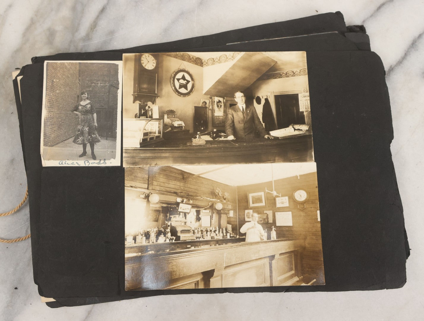Lot 010 - Antique Vernacular Snapshot Photo Album With 90+ Photographs Circa 1910-1920, Including Baseball Player, Woman Posing With Flag, Bartenders, Many Dogs And Pets, And More