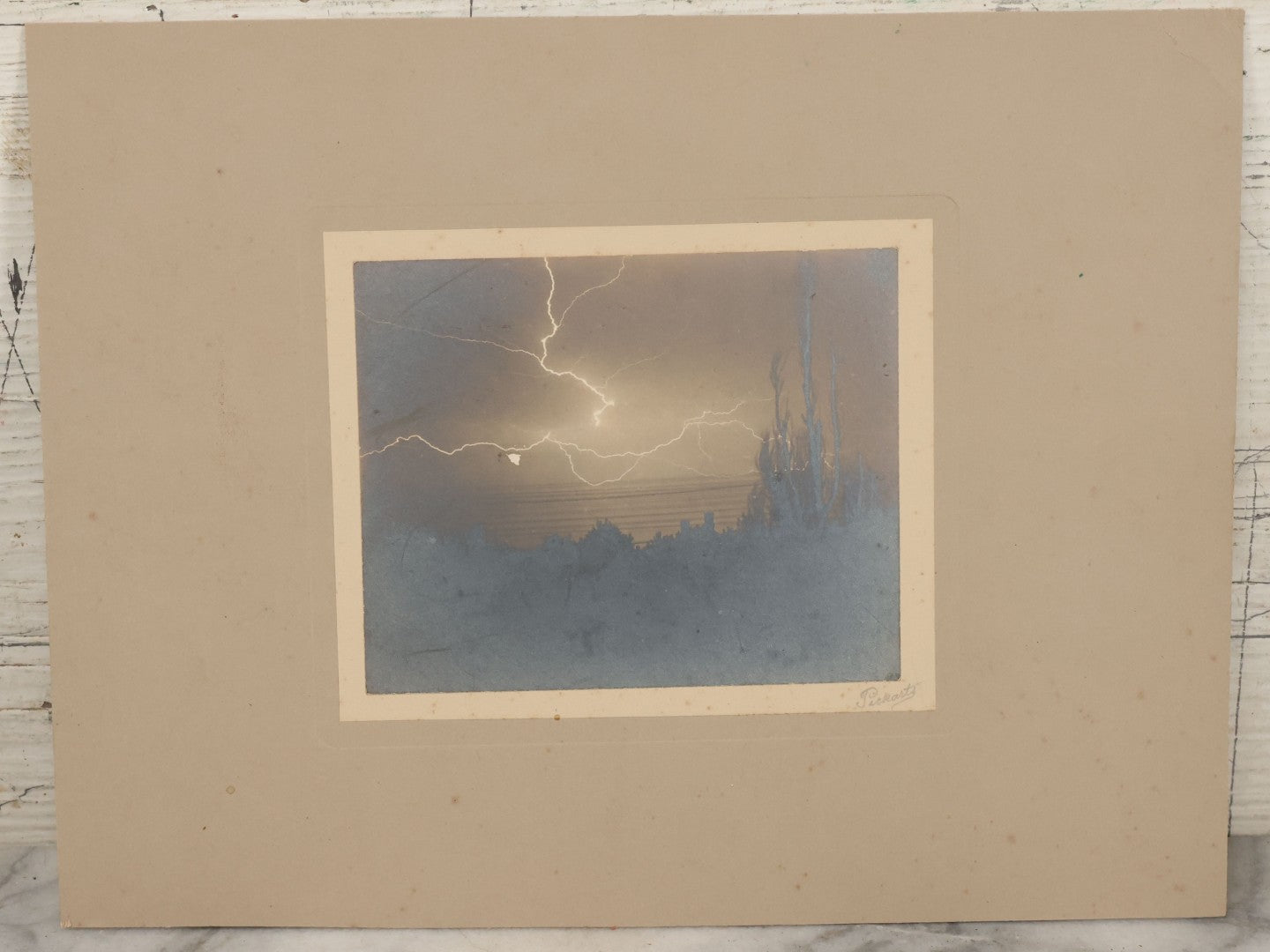 Lot 012 - Antique Boarded Photograph Of Lightning Storm Raging Over Lake Mendota, Madison, Wisconsin, Photographed And Signed By Lucien J. Pickarts, With Newspaper Write Up Promoting Photo On Verso, Note Small Loss To Photo Left Middle, 11" x 8-1/2"