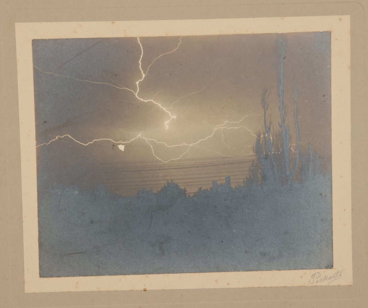 Lot 012 - Antique Boarded Photograph Of Lightning Storm Raging Over Lake Mendota, Madison, Wisconsin, Photographed And Signed By Lucien J. Pickarts, With Newspaper Write Up Promoting Photo On Verso, Note Small Loss To Photo Left Middle, 11" x 8-1/2"
