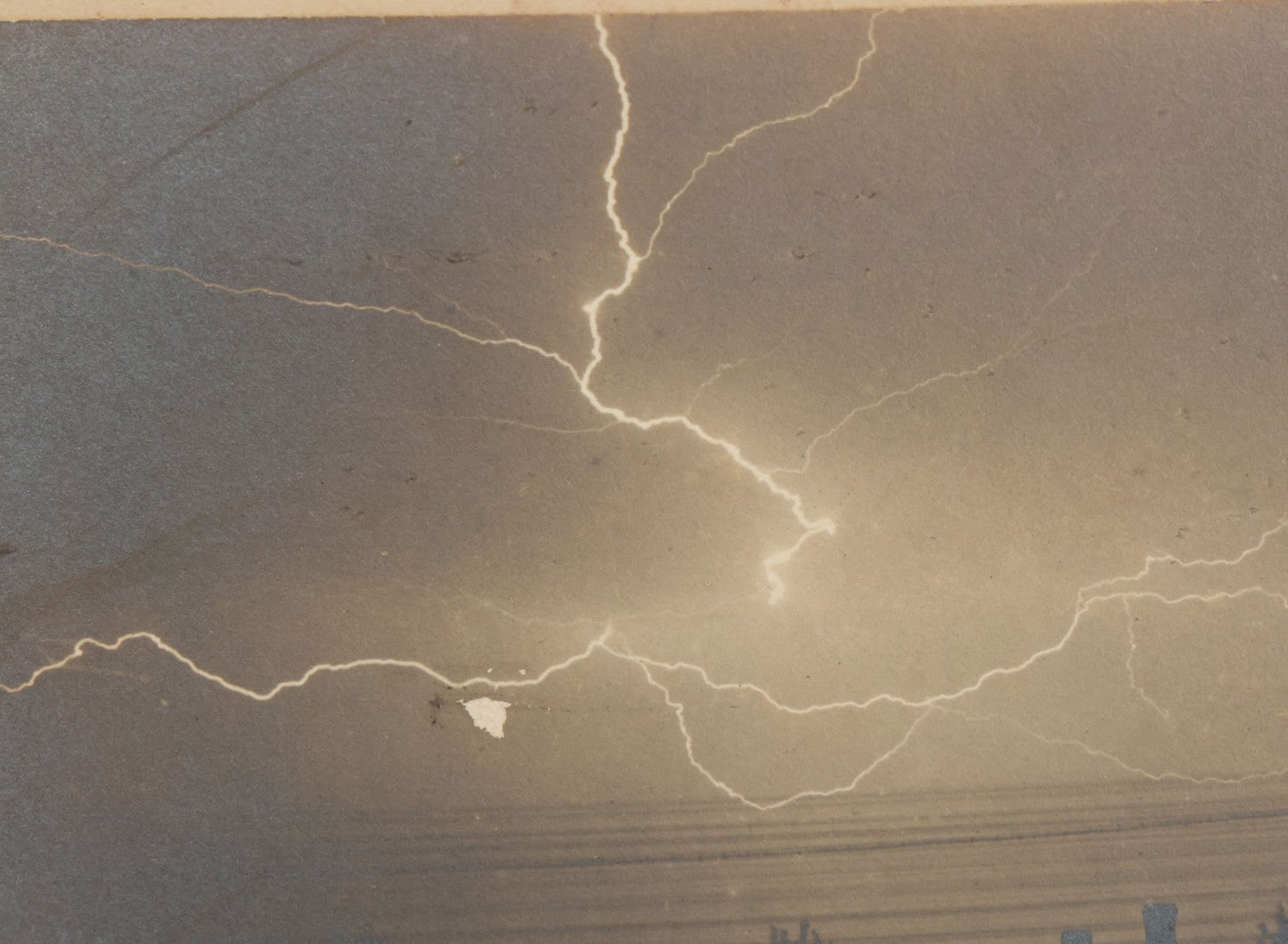 Lot 012 - Antique Boarded Photograph Of Lightning Storm Raging Over Lake Mendota, Madison, Wisconsin, Photographed And Signed By Lucien J. Pickarts, With Newspaper Write Up Promoting Photo On Verso, Note Small Loss To Photo Left Middle, 11" x 8-1/2"