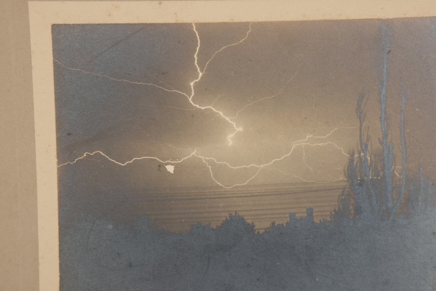Lot 012 - Antique Boarded Photograph Of Lightning Storm Raging Over Lake Mendota, Madison, Wisconsin, Photographed And Signed By Lucien J. Pickarts, With Newspaper Write Up Promoting Photo On Verso, Note Small Loss To Photo Left Middle, 11" x 8-1/2"