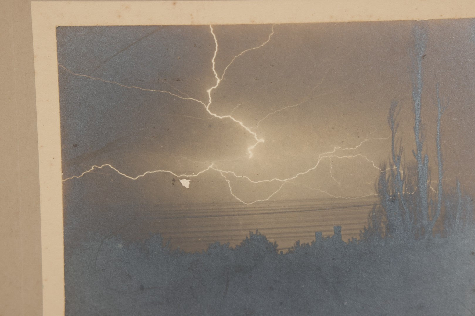 Lot 012 - Antique Boarded Photograph Of Lightning Storm Raging Over Lake Mendota, Madison, Wisconsin, Photographed And Signed By Lucien J. Pickarts, With Newspaper Write Up Promoting Photo On Verso, Note Small Loss To Photo Left Middle, 11" x 8-1/2"