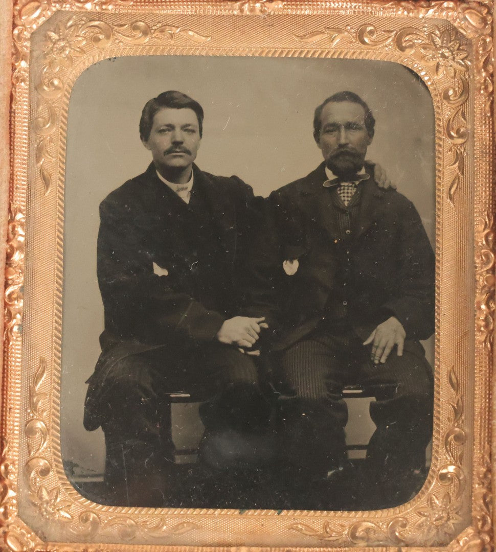Lot 017 - Antique 1/6th Plate Tintype Photograph Of Two Men, Likely A Father And Son, Sharing An Embrace, Holding Hands, In Full Split Leatherette Union Case