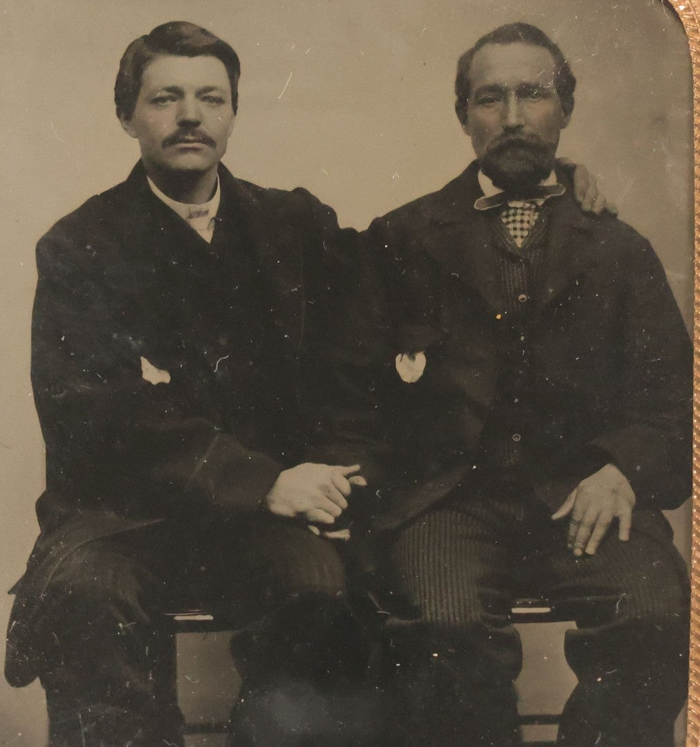 Lot 017 - Antique 1/6th Plate Tintype Photograph Of Two Men, Likely A Father And Son, Sharing An Embrace, Holding Hands, In Full Split Leatherette Union Case