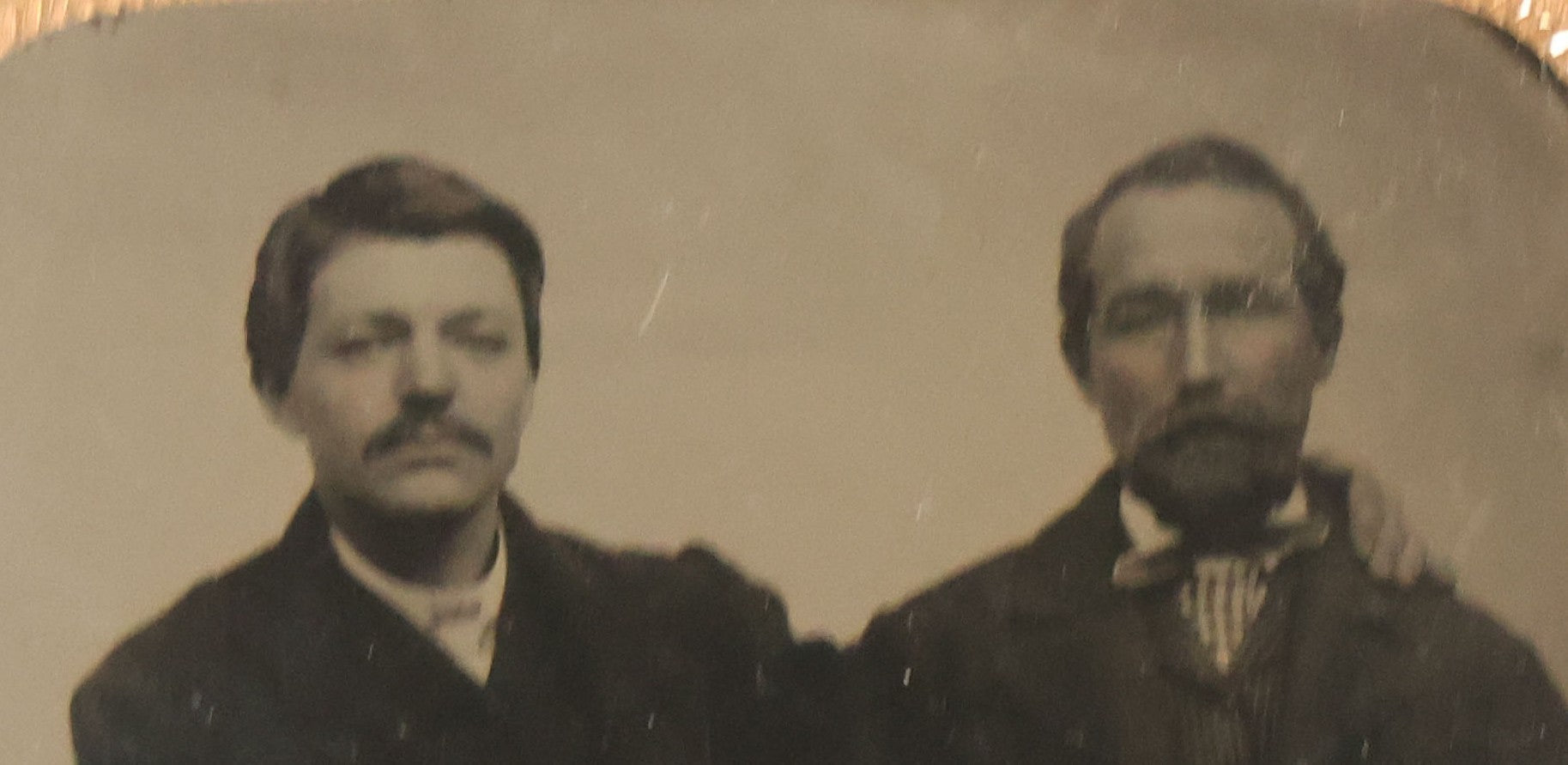 Lot 017 - Antique 1/6th Plate Tintype Photograph Of Two Men, Likely A Father And Son, Sharing An Embrace, Holding Hands, In Full Split Leatherette Union Case