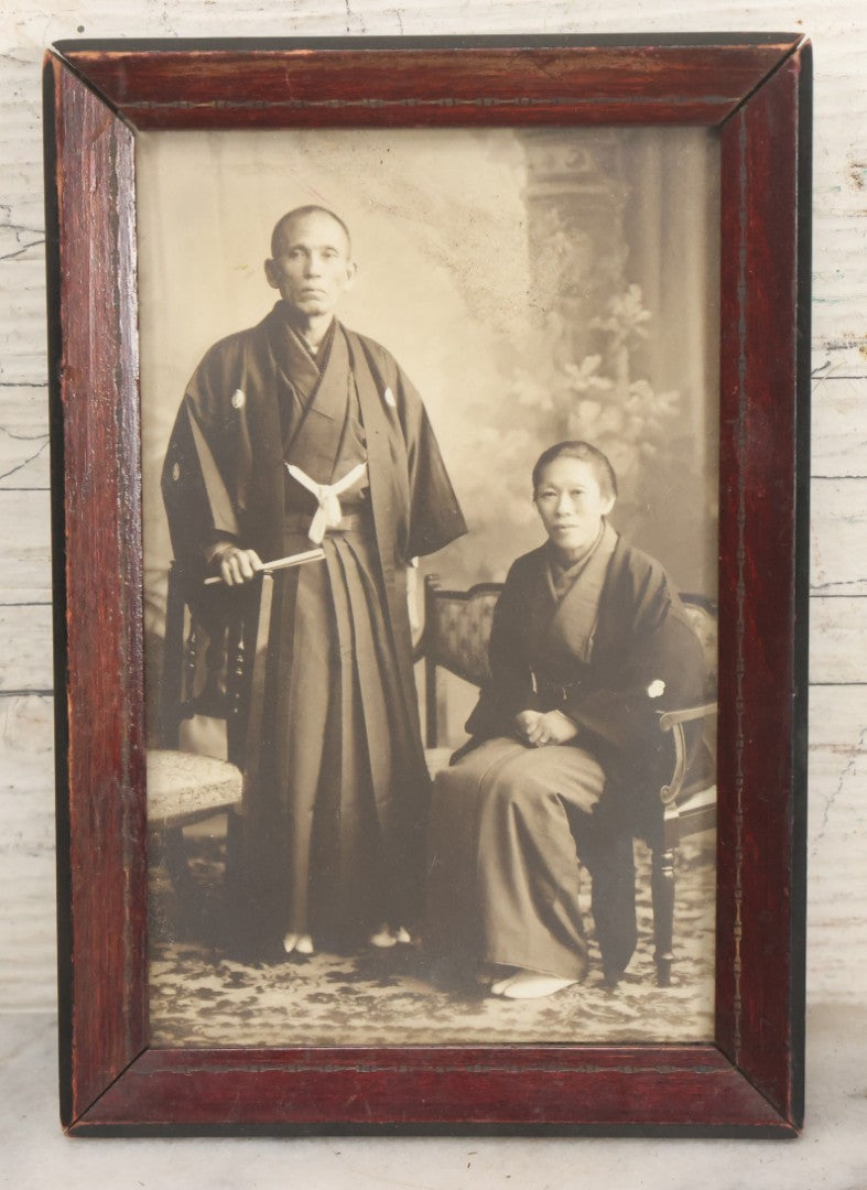 Lot 018 - Antique Trimmed Boarded Photograph Of A Japanese Couple In Frame, Identified On Verso As Shikazo Or Rokuzo, Age 73 Years, Photographed January 6, 1914, Tsujiko Town (Town Or Neighborhood), 4-3/8" x 6-3/8"